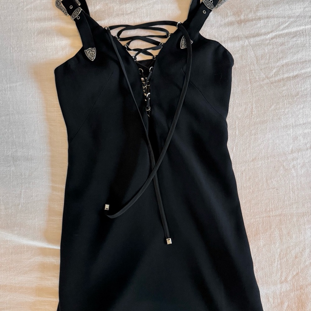 Black Plunge Neck mini dress with silver hardwear details.